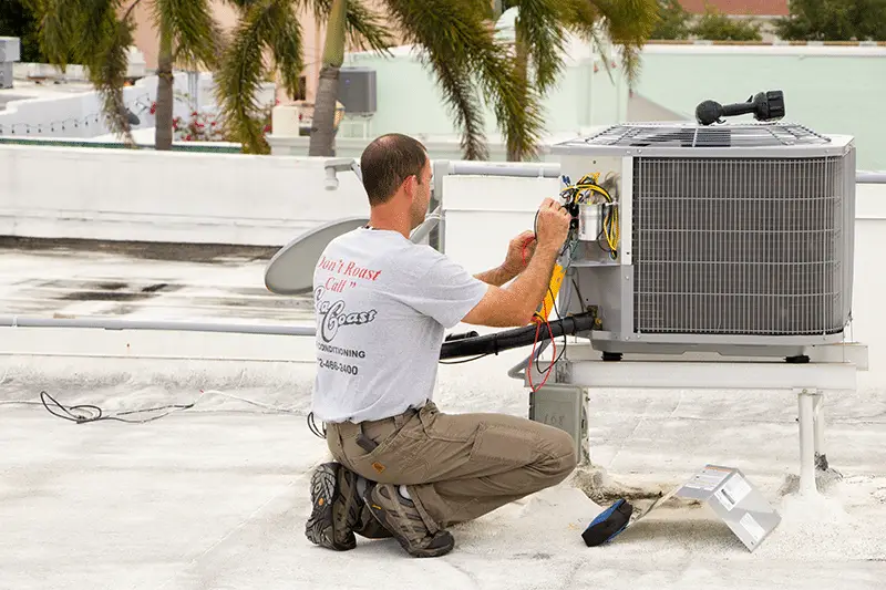 A SeaCoast Technician doing AC repairs
